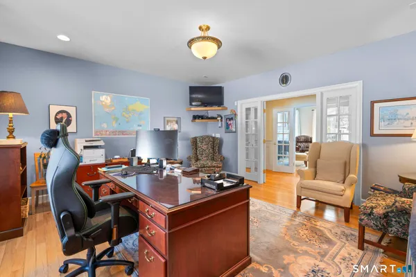 a living room with furniture and a lamp