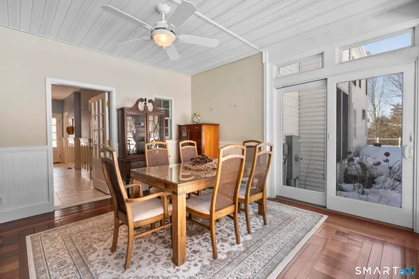 a view of a dining room with furniture and wooden floor