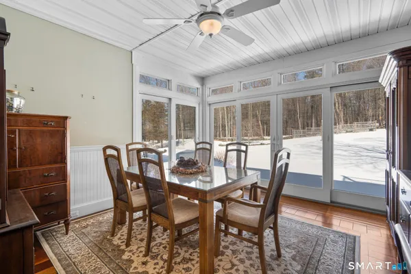 a view of a dining room with furniture window and outside view