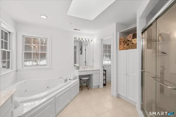 a bathroom with a bathtub and a shower