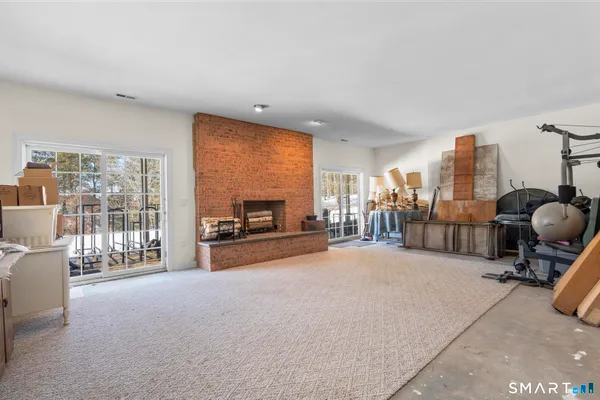 a view of a livingroom with furniture and a fireplace