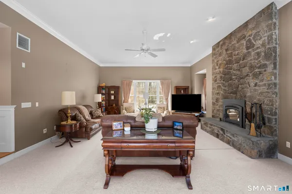 a living room with furniture and a fireplace