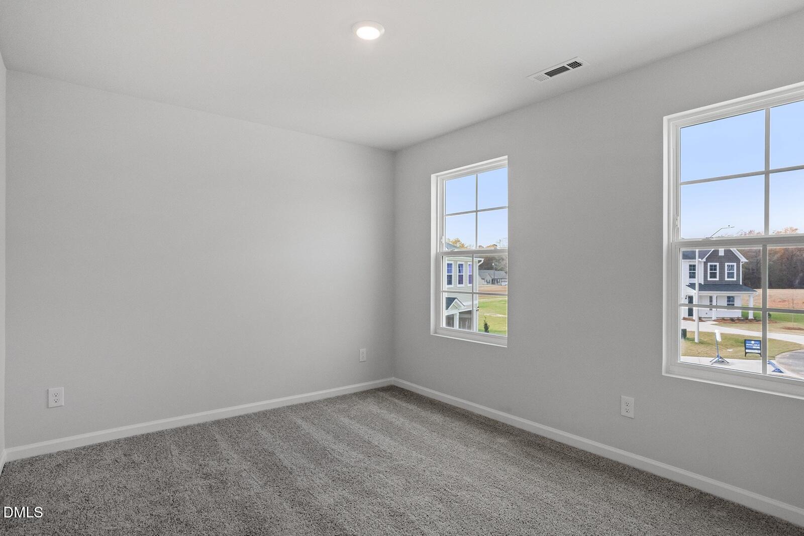 79 Osgood Street Angier, NC 27501 - Photo 30 of 31 an empty room with windows