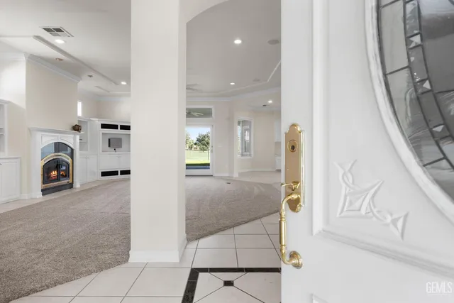 a view of an entryway with wooden floor