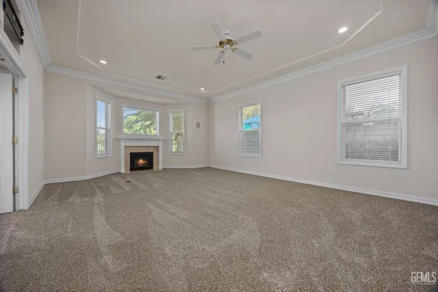 a living room with a fireplace and a window