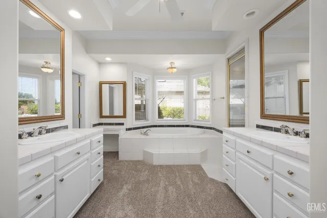 a white bath tub sitting next to a window