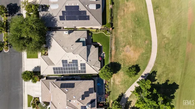 an aerial view of a house with a yard lake view and mountain view