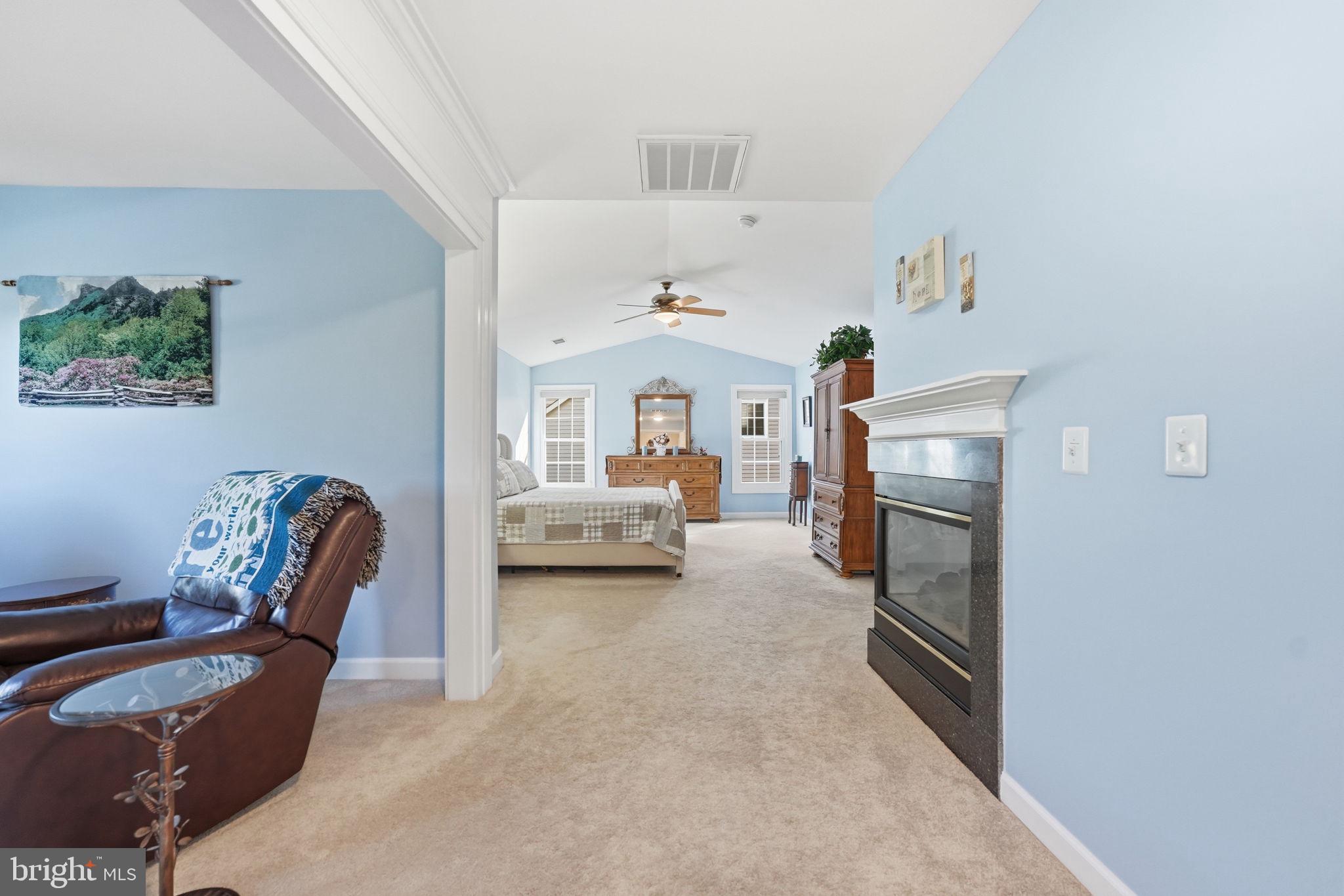 14261 Clubhouse Road Gainesville, VA 20155 - Photo 35 of 102 Primary suite with sitting room & corner fireplace