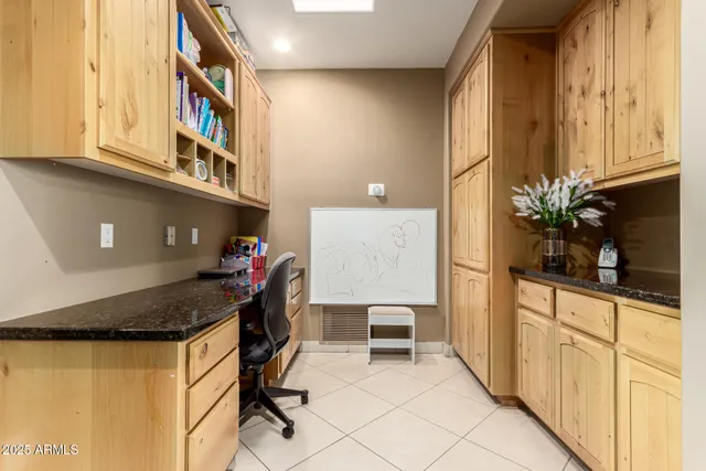 a kitchen with stainless steel appliances granite countertop a sink and cabinets