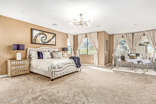 a bedroom with a large bed and a window