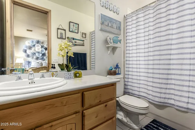 a bedroom with a bed and glass window