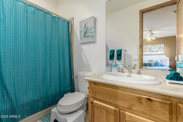 a bed room with a bed and a chair