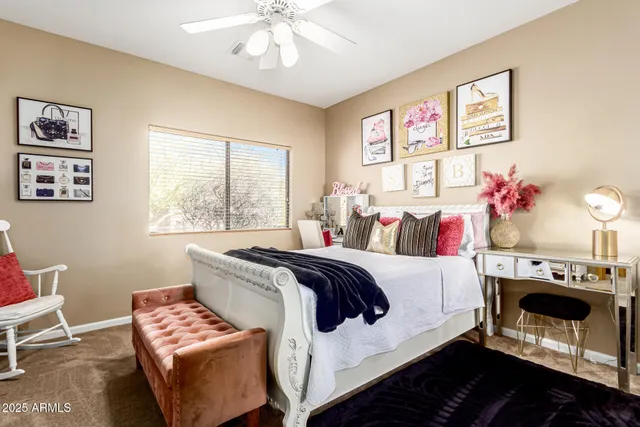 a bedroom with a large bed and a large window