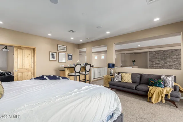 a kitchen with stainless steel appliances granite countertop a sink a stove and a refrigerator