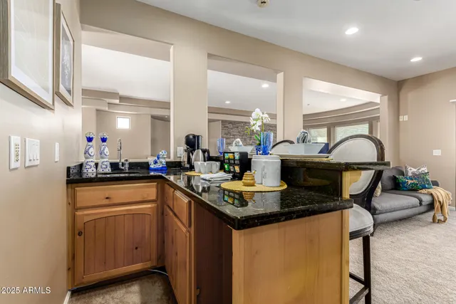 a view of a swimming pool and mountain from a living room