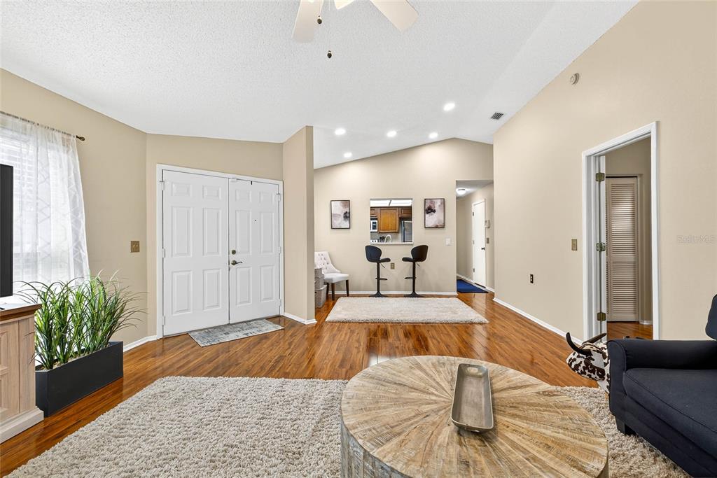 4658 Wallingford Court New Port Richey, FL 34655 - Photo 3 of 48 a bedroom with a bed and a couch