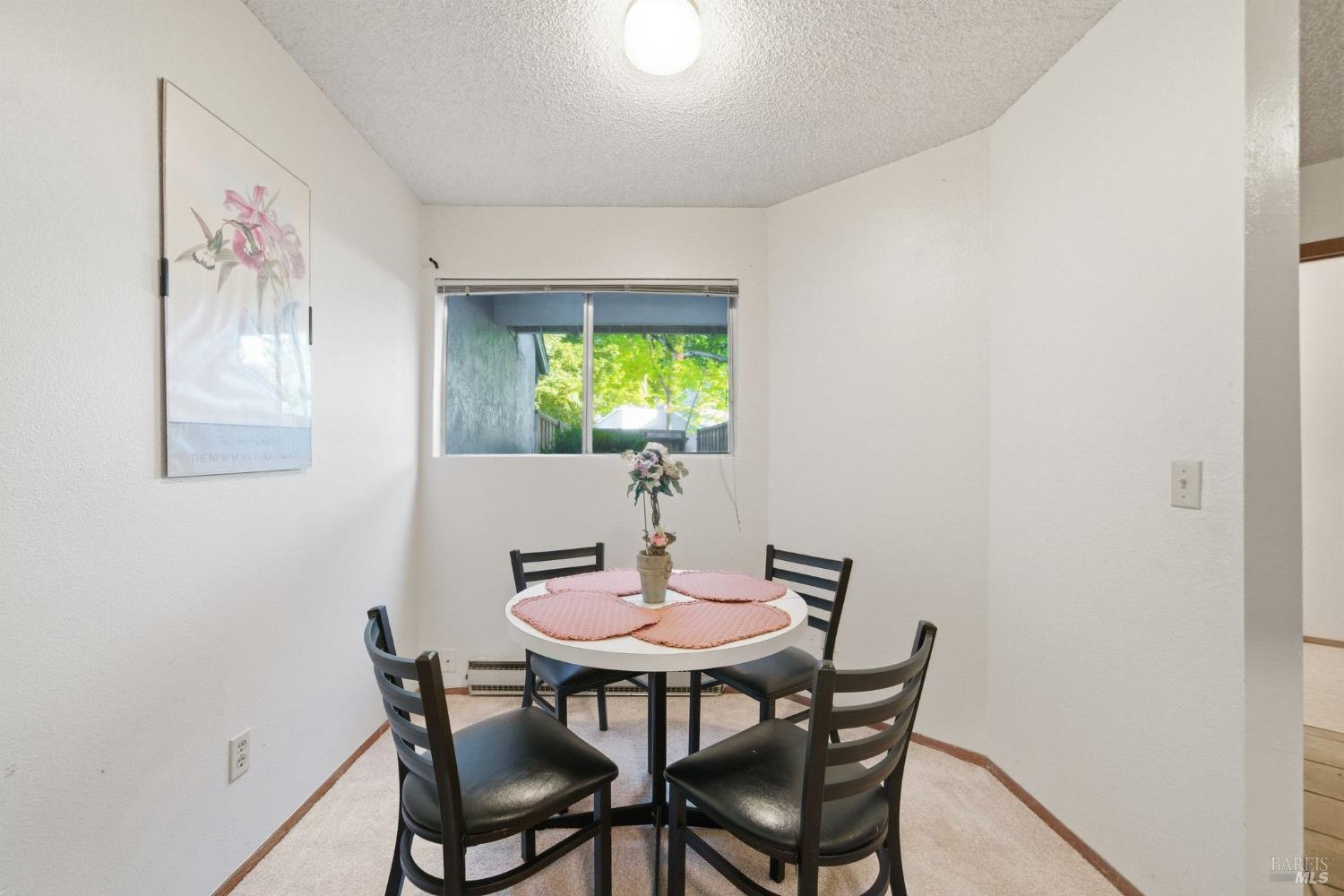 514 Racquet Club Circle Rohnert Park, CA 94928 - Photo 13 of 39 a dining room with furniture and a potted plant