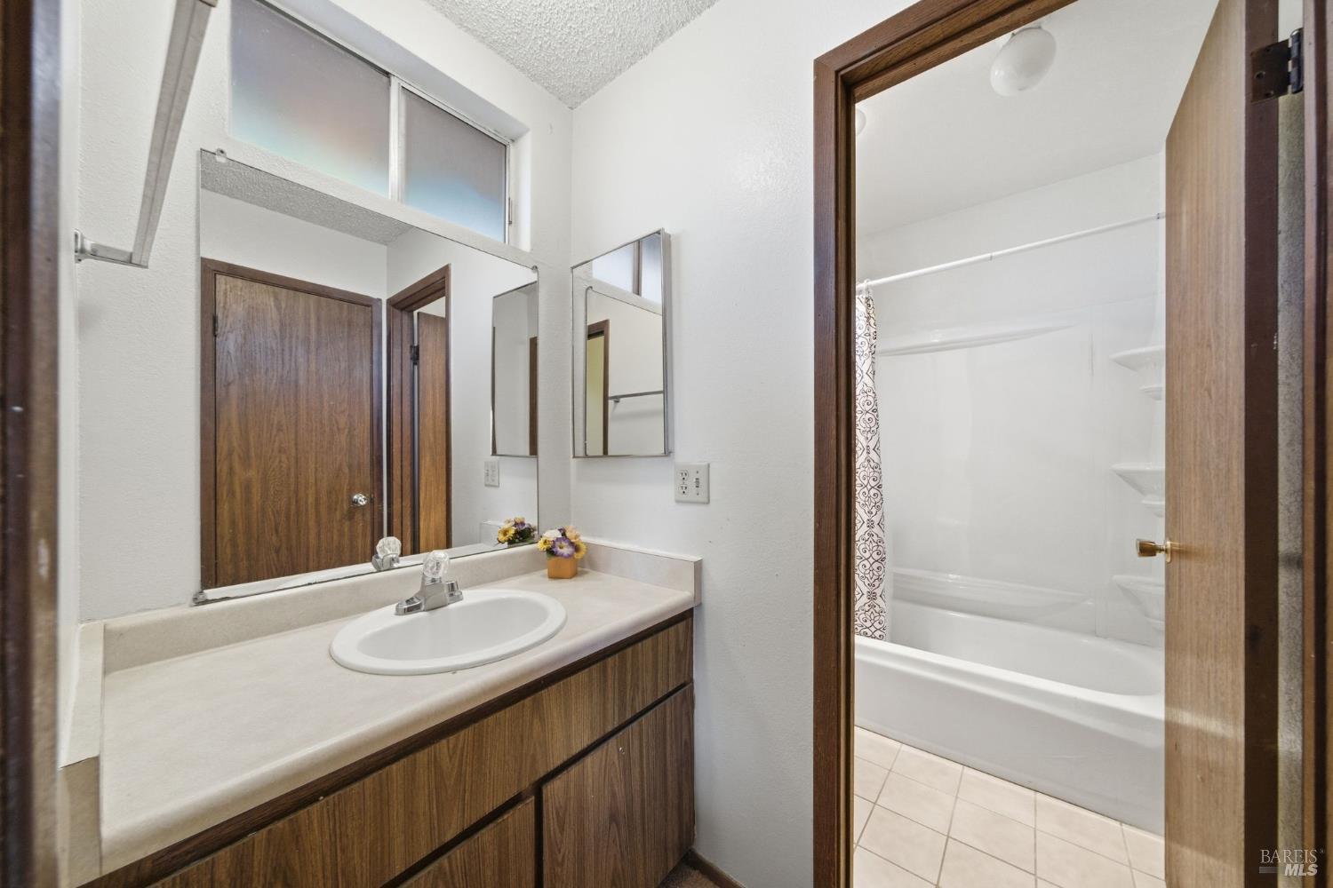 514 Racquet Club Circle Rohnert Park, CA 94928 - Photo 20 of 39 a bathroom with a sink and a mirror