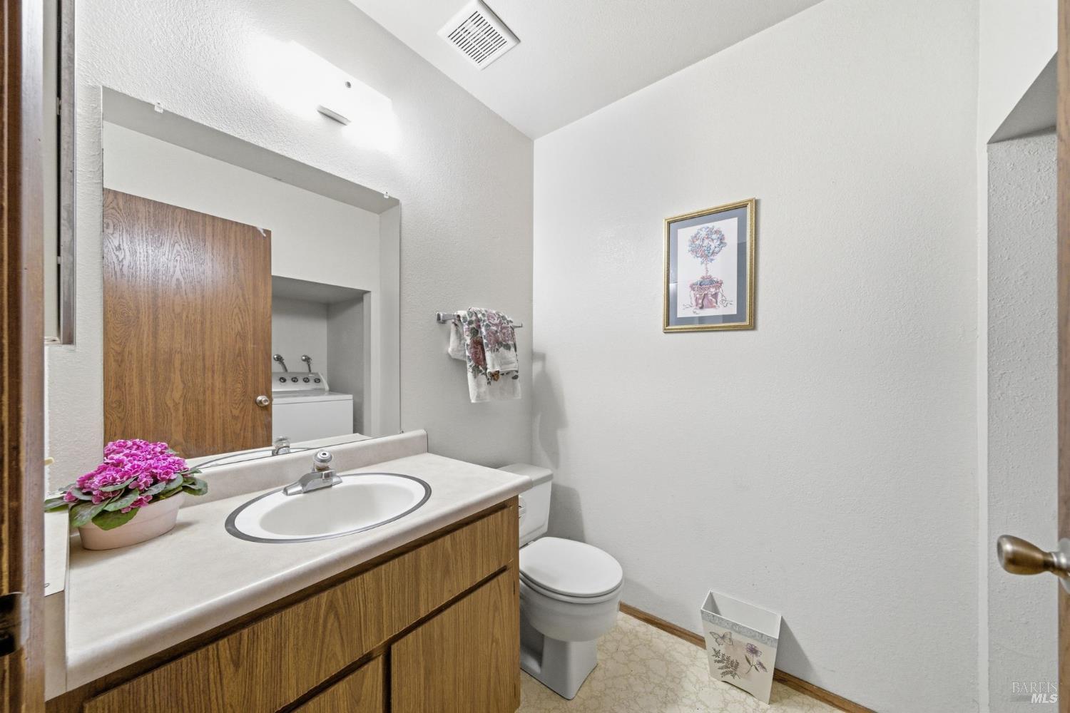 514 Racquet Club Circle Rohnert Park, CA 94928 - Photo 24 of 39 a bathroom with a sink and mirror with toilet