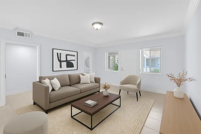 a living room with furniture and a window