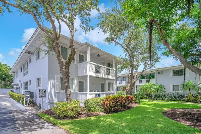 a view of a building with a garden