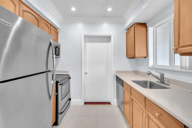 a bathroom with a sink a mirror and a window