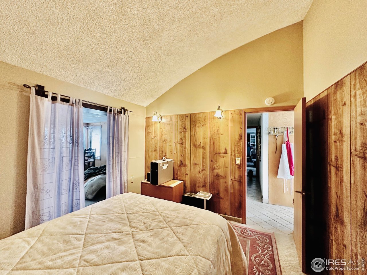 55999 Highway 318 Maybell, CO 81640 - Photo 24 of 50 a bedroom with a bed and a large mirror