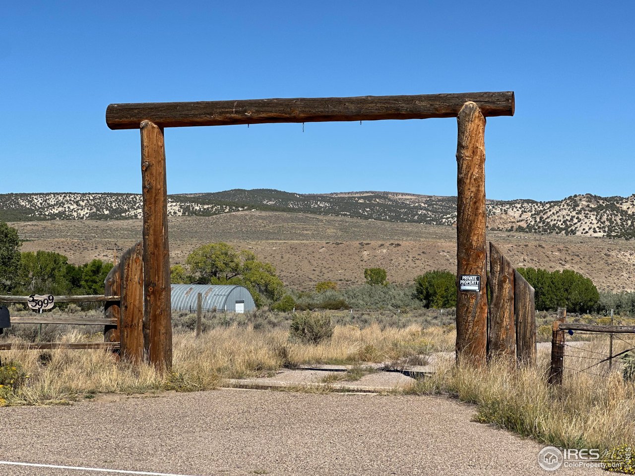 55999 Highway 318 Maybell, CO 81640 - Photo 27 of 50 a street sign on a sidewalk next to a road