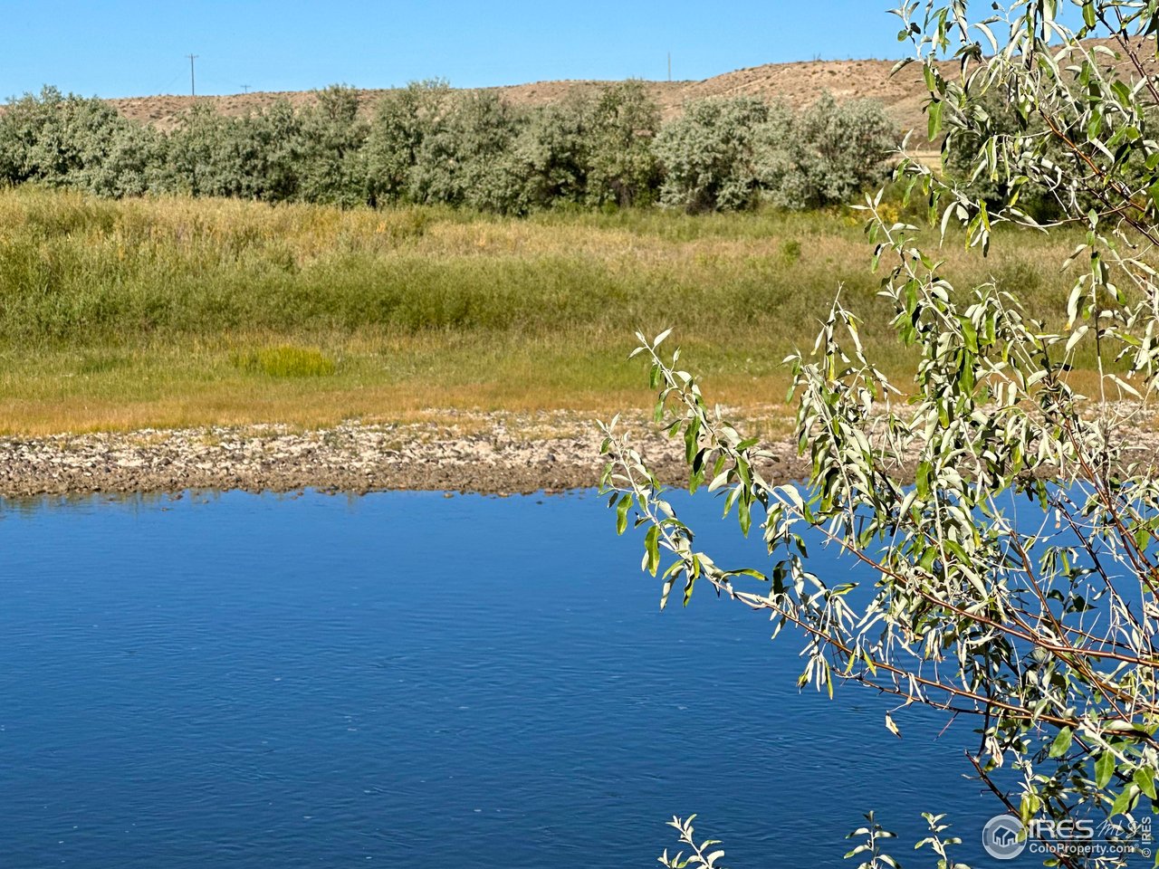 55999 Highway 318 Maybell, CO 81640 - Photo 4 of 50 a view of a lake with a mountain in the background