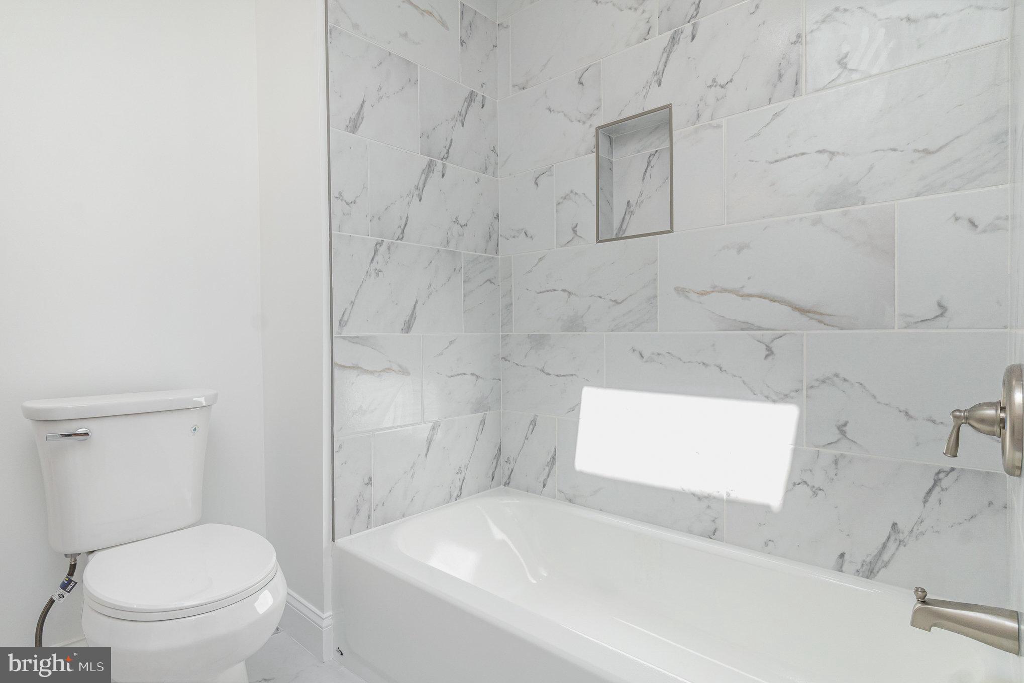 727 North Collington Avenue Baltimore, MD 21205 - Photo 18 of 25 a bathroom with a toilet and a sink