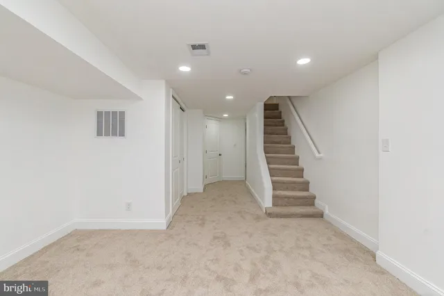 an entryway in a hall with a window