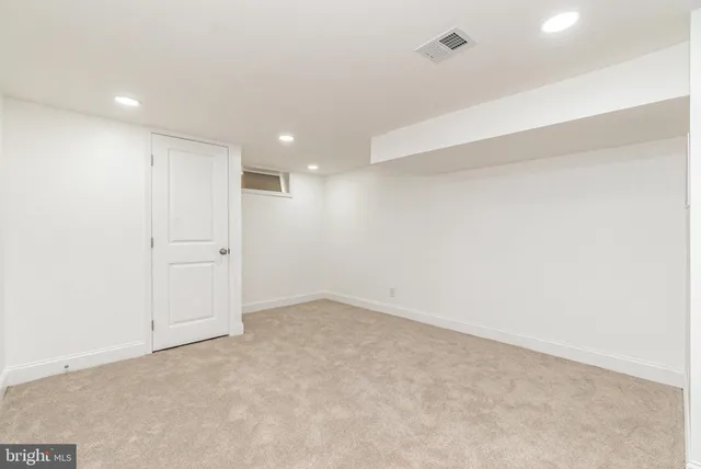 an empty room with a empty space and windows