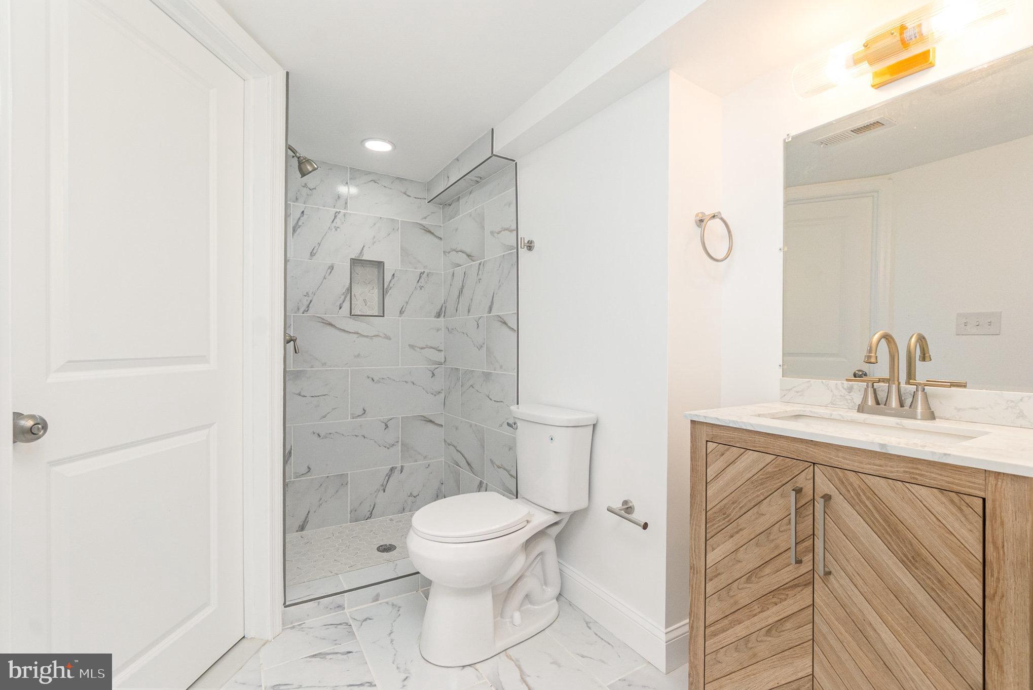 727 North Collington Avenue Baltimore, MD 21205 - Photo 23 of 25 a bathroom with a toilet sink and shower