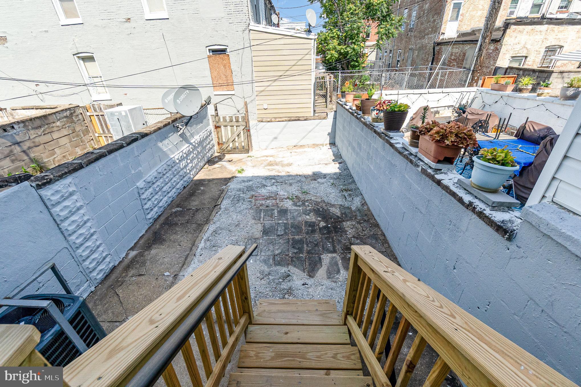 727 North Collington Avenue Baltimore, MD 21205 - Photo 24 of 25 a balcony with two chairs and a table