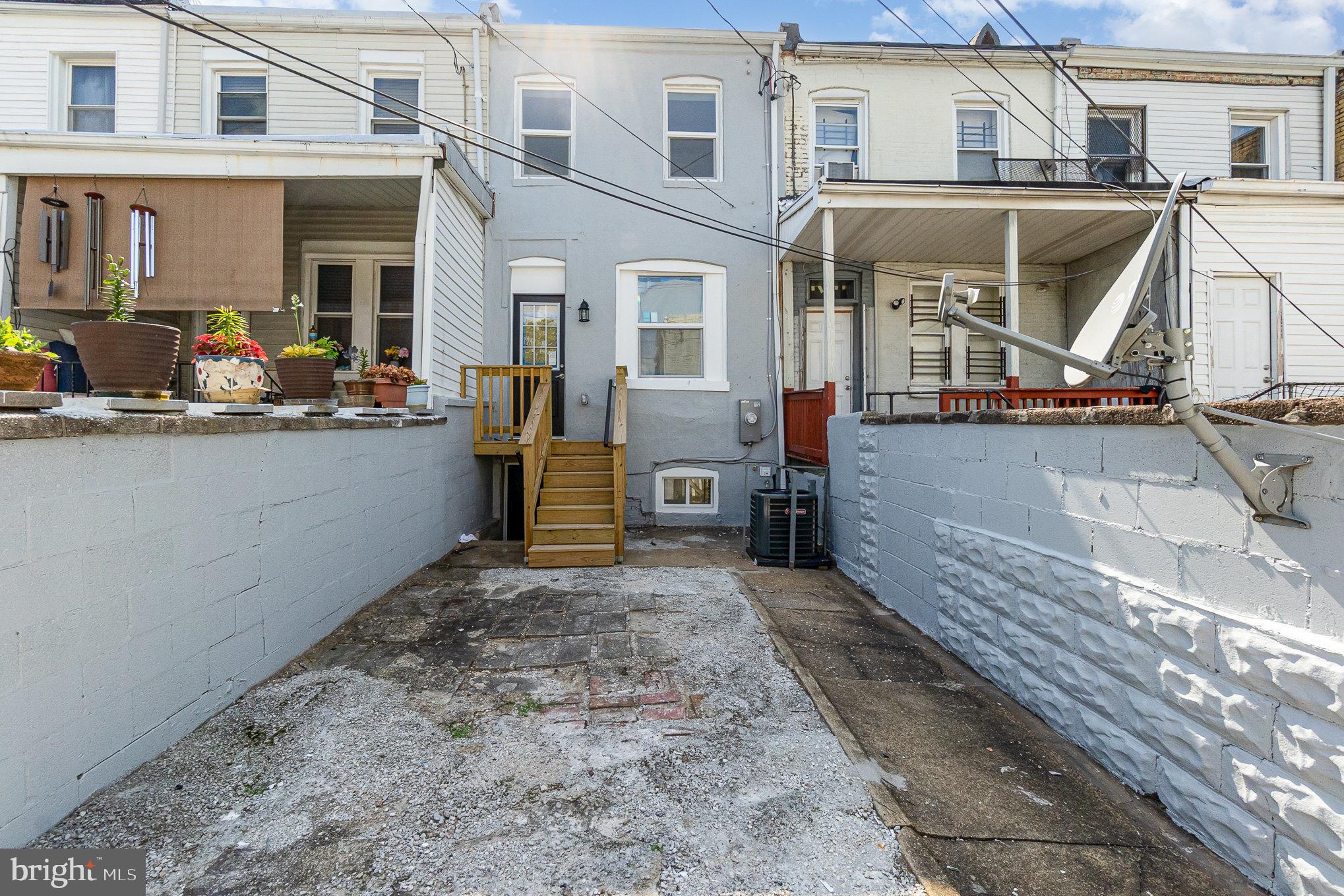 727 North Collington Avenue Baltimore, MD 21205 - Photo 25 of 25 a view of a house with many windows