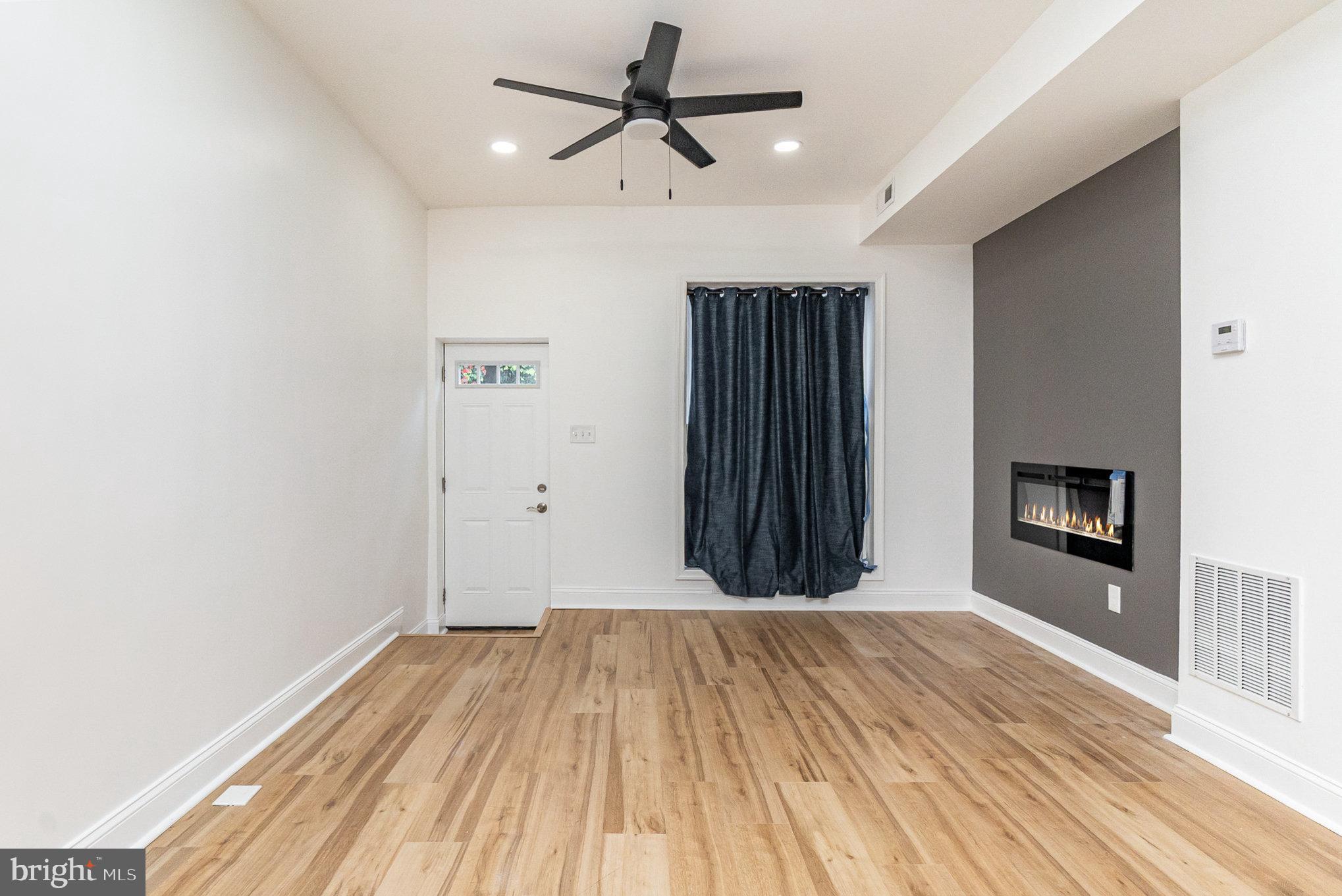 727 North Collington Avenue Baltimore, MD 21205 - Photo 3 of 25 wooden floor in a hall with an entryway