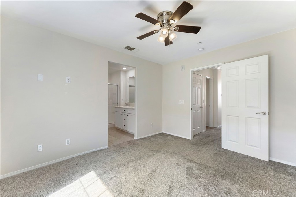 2890 Silver Medal Road, Unit 9 Chula Vista, CA 91915 - Photo 13 of 31 Primary bedroom looking to bathroom and hallway
*Photos have been digitallyenhanced