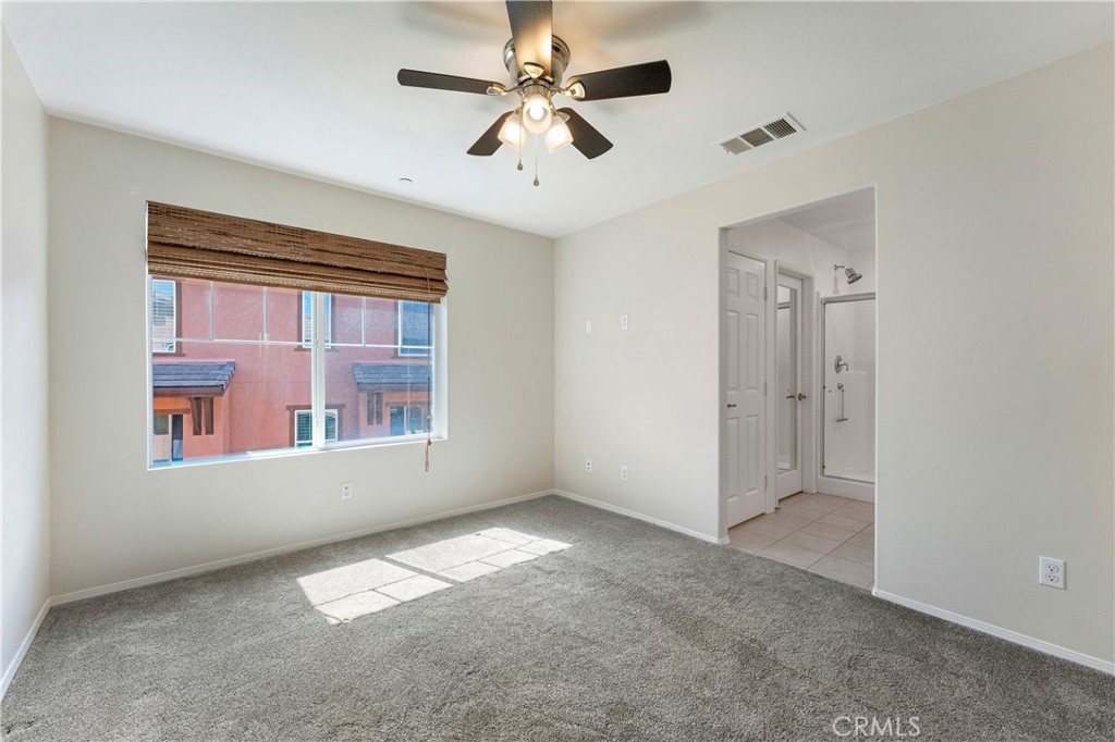 2890 Silver Medal Road, Unit 9 Chula Vista, CA 91915 - Photo 14 of 31 Primary bedroom looking to window and bathroom
*Photos have been digitallyenhanced