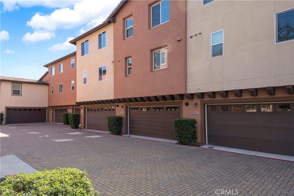 2890 Silver Medal Road, Unit 9 Chula Vista, CA 91915 - Photo 24 of 31 Driveway to attached garage
*Photos have been digitallyenhanced