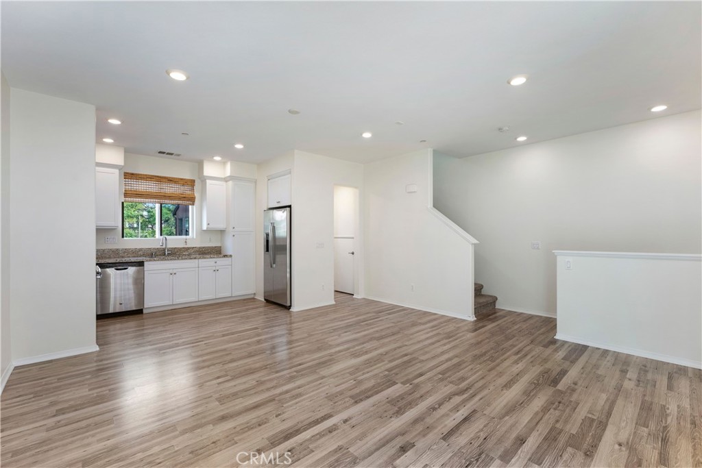 2890 Silver Medal Road, Unit 9 Chula Vista, CA 91915 - Photo 6 of 31 Family Room looking into kitchen and stairs
*Photos have been digitallyenhanced