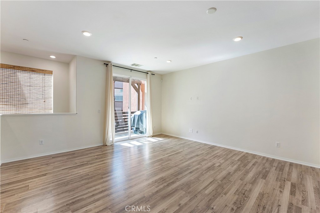 2890 Silver Medal Road, Unit 9 Chula Vista, CA 91915 - Photo 7 of 31 Family Room looking to door to balcony
*Photos have been digitallyenhanced