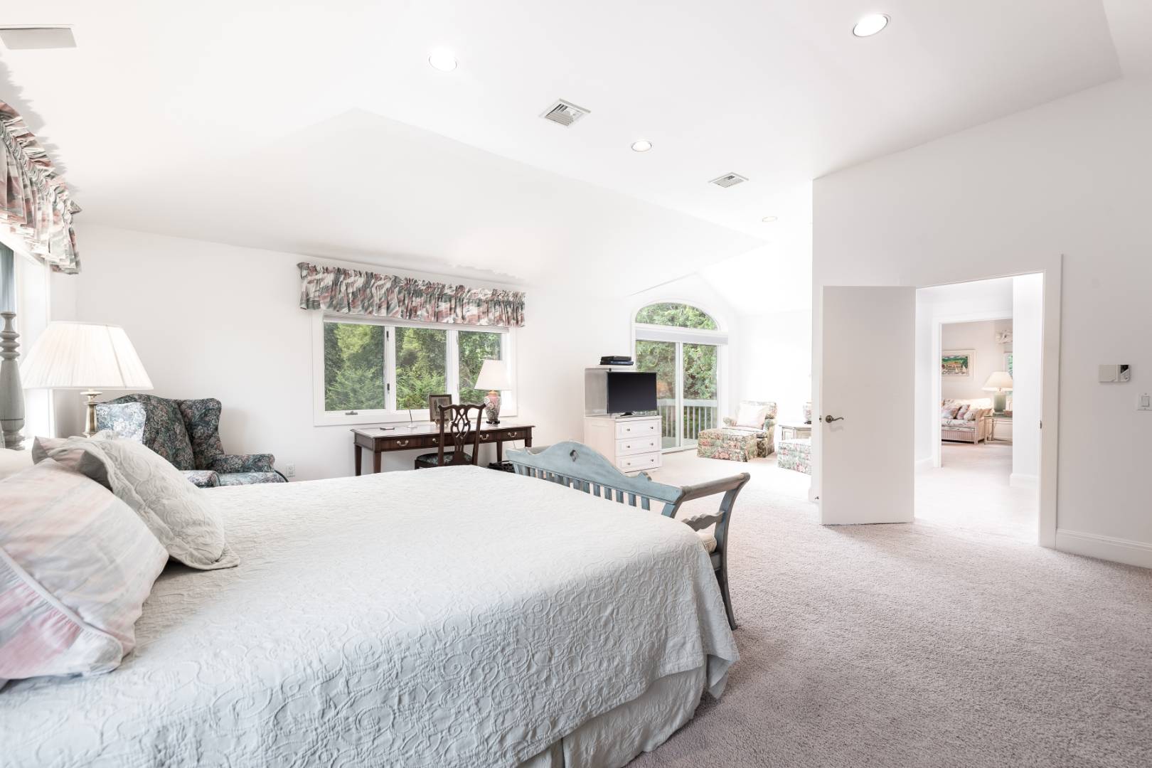 15 Atterbury Road Southampton, NY 11968 - Photo 14 of 20 a large bedroom with a bed and large windows