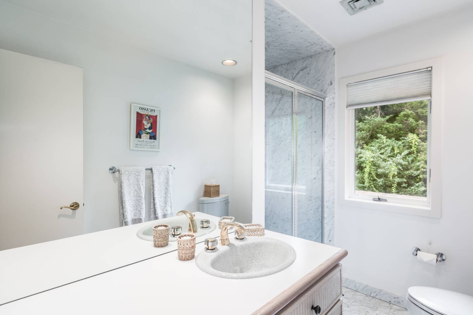 15 Atterbury Road Southampton, NY 11968 - Photo 18 of 20 a bathroom with a sink and a mirror