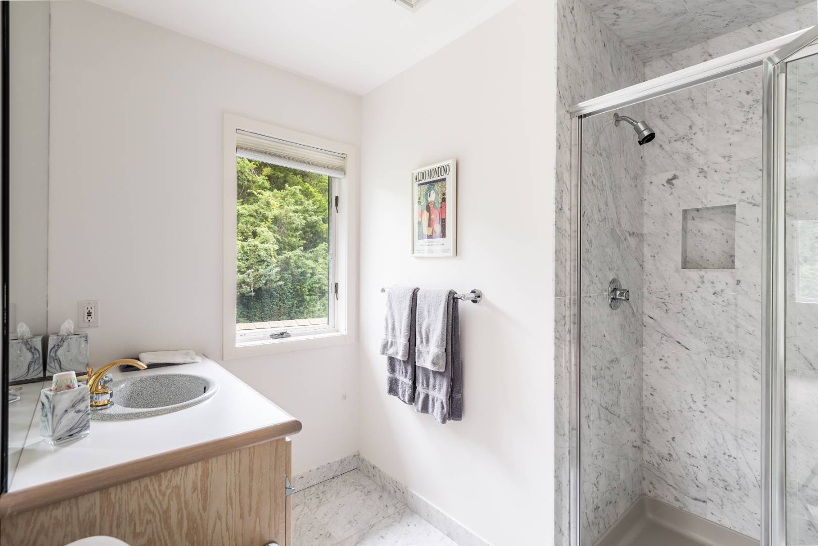 15 Atterbury Road Southampton, NY 11968 - Photo 19 of 20 a bathroom with a sink vanity and a mirror