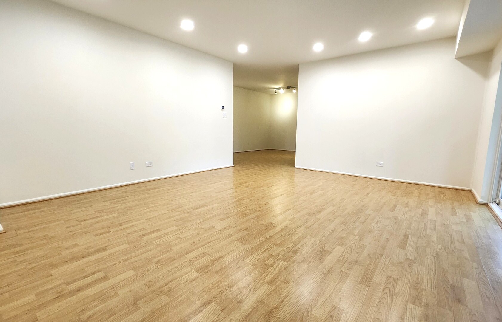 1450 Sandpebble Drive, Unit 333 Wheeling, IL 60090 - Photo 9 of 22 an empty room with wooden floor and entrance