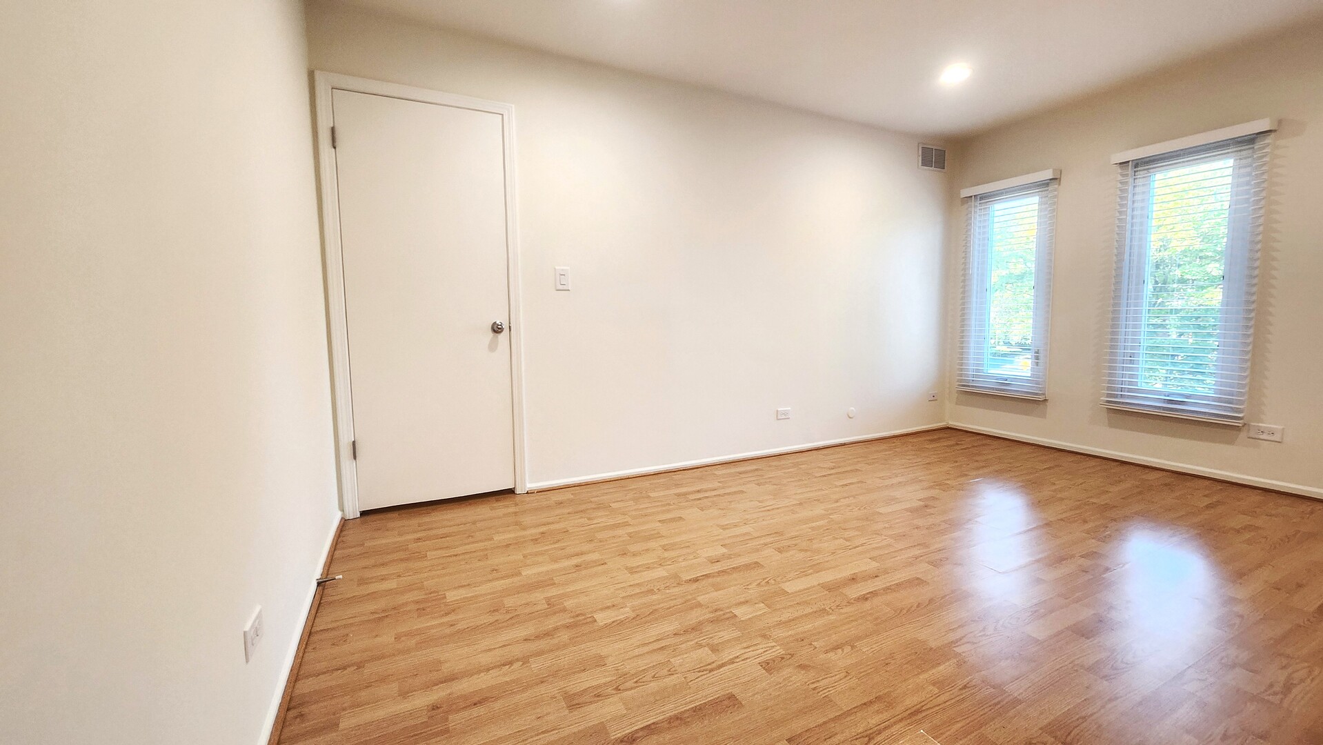 1450 Sandpebble Drive, Unit 333 Wheeling, IL 60090 - Photo 14 of 22 an empty room with wooden floor and windows