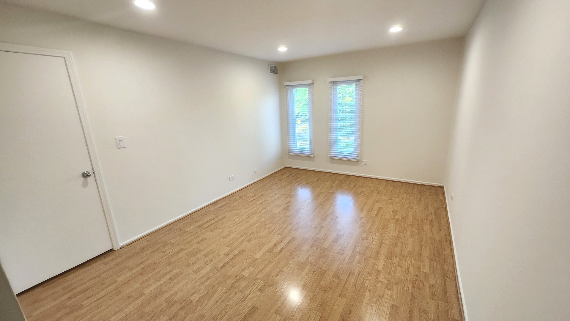 1450 Sandpebble Drive, Unit 333 Wheeling, IL 60090 - Photo 15 of 22 an empty room with wooden floor and windows