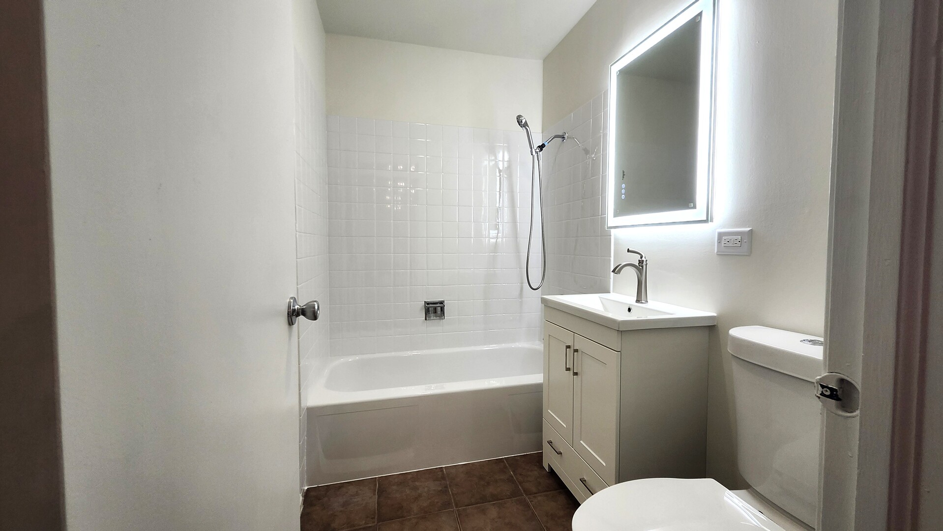 1450 Sandpebble Drive, Unit 333 Wheeling, IL 60090 - Photo 17 of 22 a bathroom with a sink toilet and shower