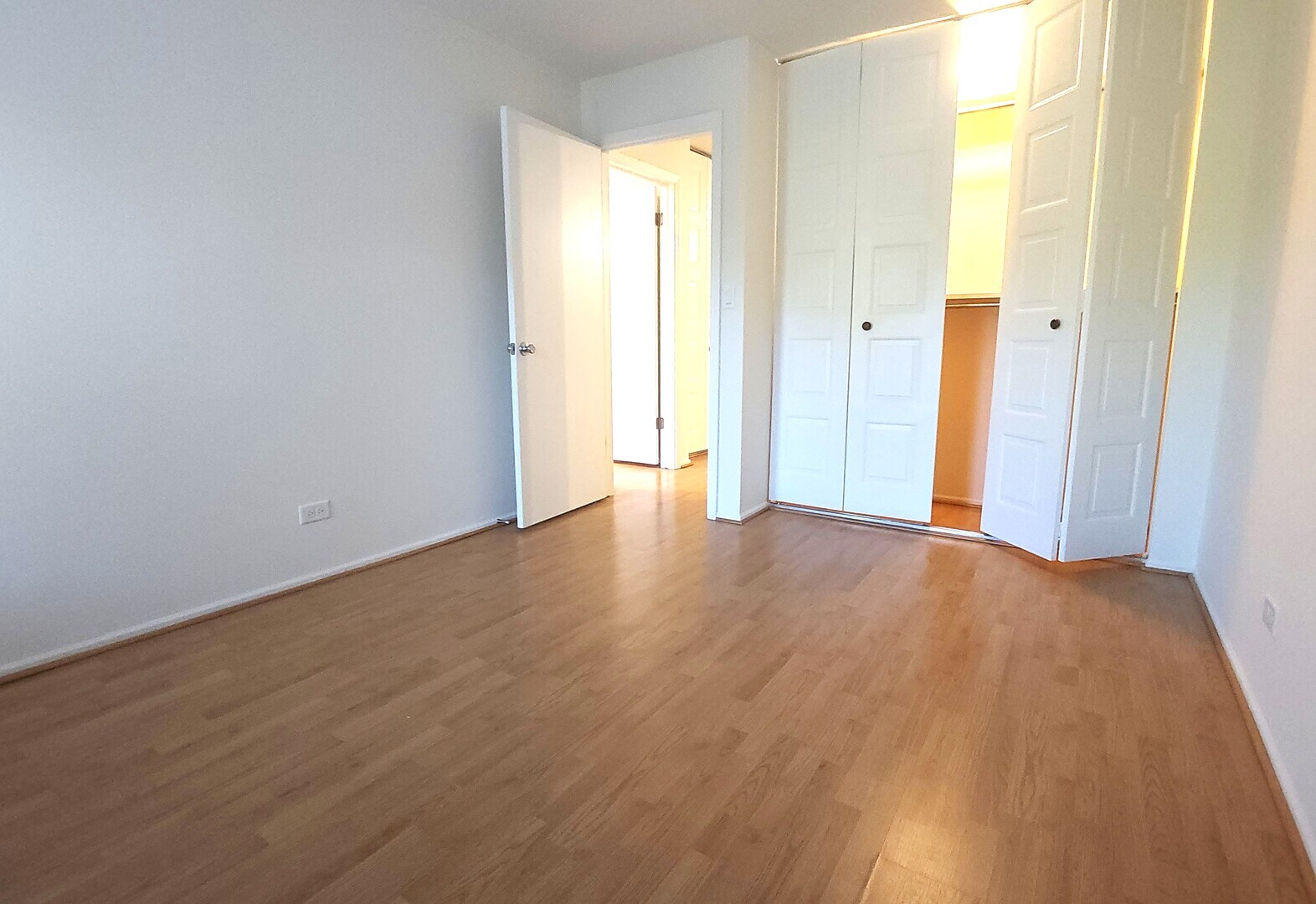 1450 Sandpebble Drive, Unit 333 Wheeling, IL 60090 - Photo 20 of 22 a view of an empty room with wooden floor and a window