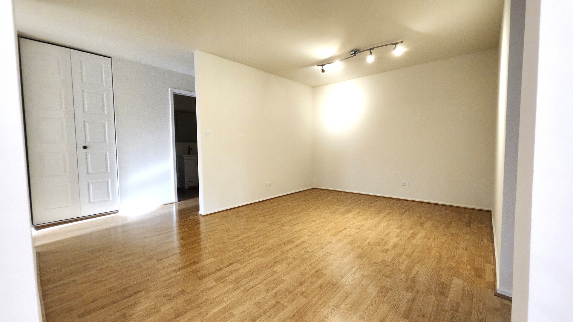 1450 Sandpebble Drive, Unit 333 Wheeling, IL 60090 - Photo 3 of 22 a view of an empty room with wooden floor